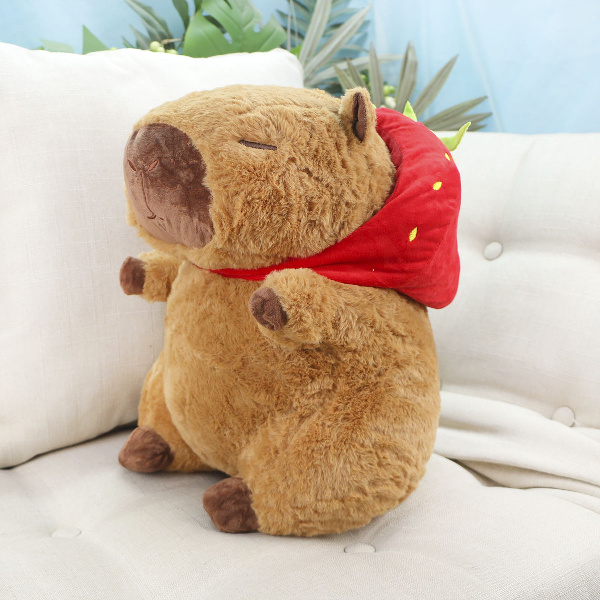 фото игрушки Капибара в клубничной шапке, 35 см